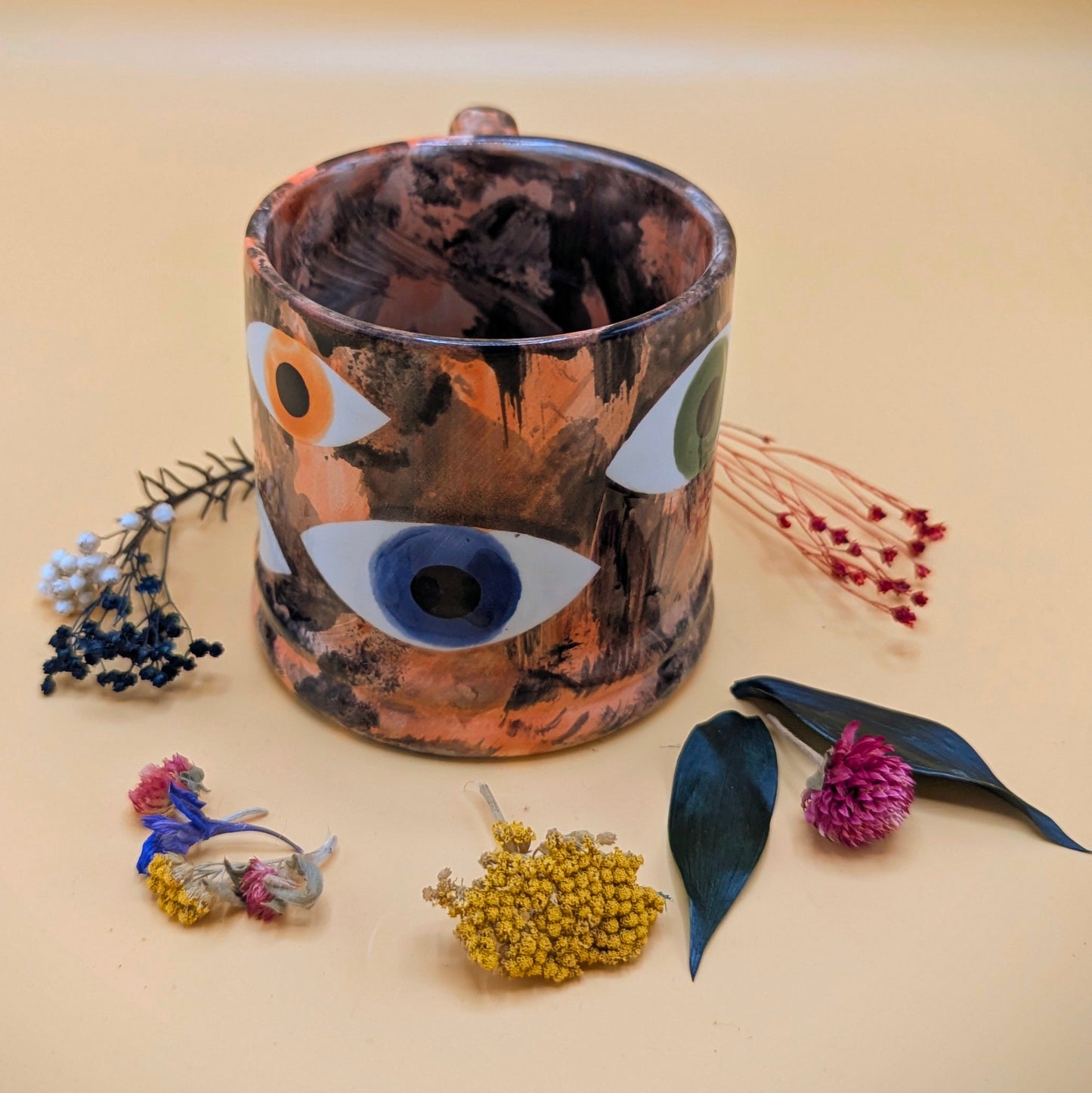'Multi Eye on Orange' Ceramic Mug by Ciara Veronica Dunne